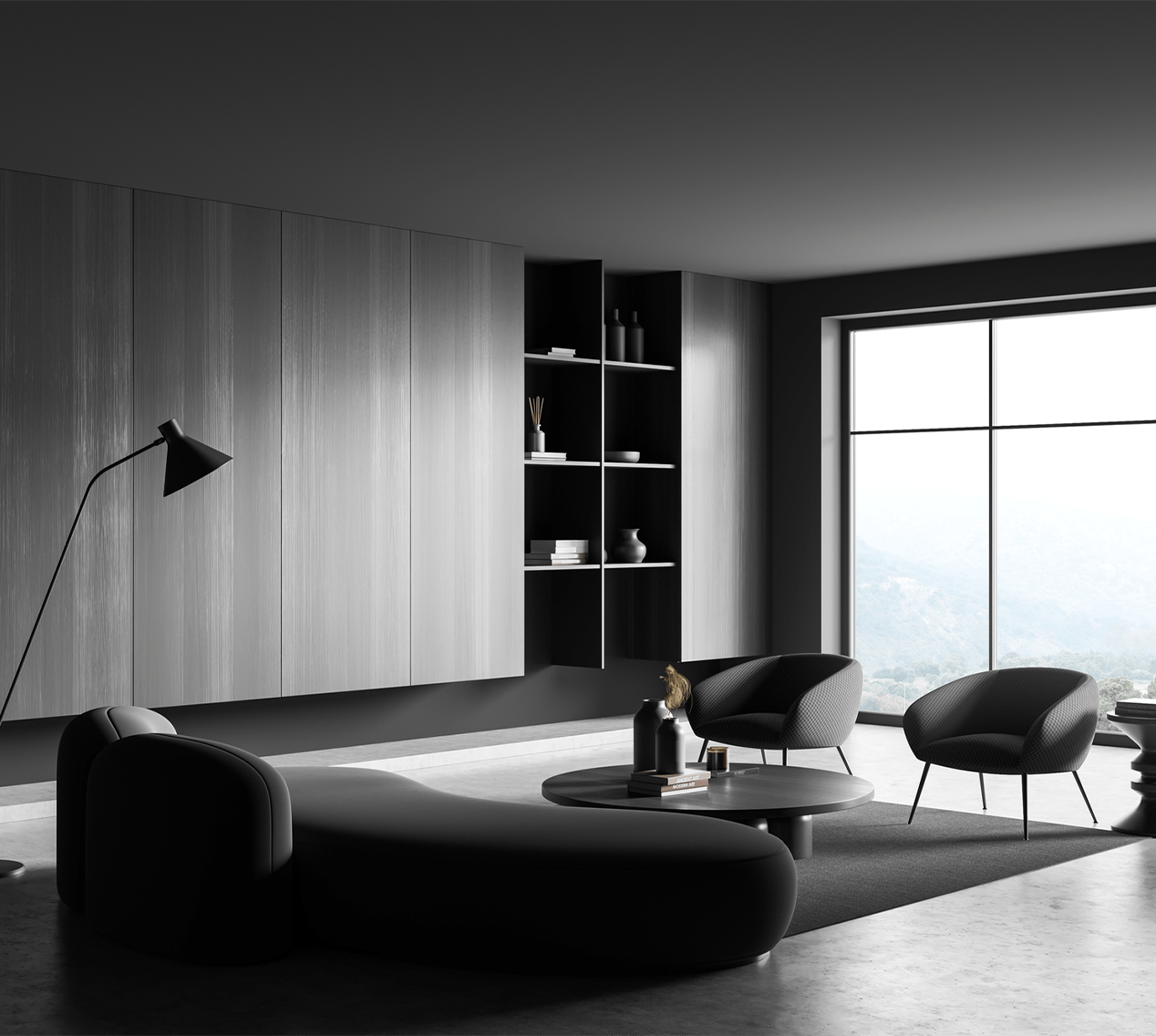 Modern living room featuring sleek furniture in black and gray tones, accentuated by a large window with a scenic view.